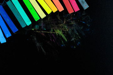 Colourful chalk pastel on black background, Concept of education background.
