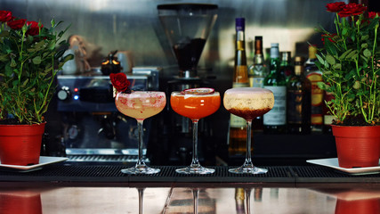 three exquisite cocktails at the bar