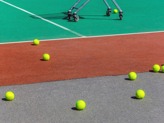 Yellow tennis balls on the tennis field. Big tennis