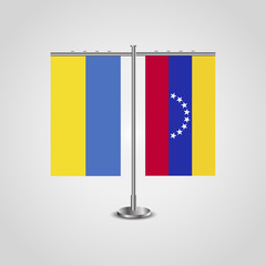 Table stand with flags of Ukraine and Venezuela.Two flag. Flag pole. Symbolizing the cooperation between the two countries. Table flags