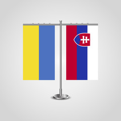 Table stand with flags of Ukraine and Slovakia.Two flag. Flag pole. Symbolizing the cooperation between the two countries. Table flags