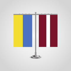Table stand with flags of Ukraine and Latvia.Two flag. Flag pole. Symbolizing the cooperation between the two countries. Table flags