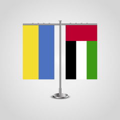 Table stand with flags of Ukraine and United Arab Emirates.Two flag. Flag pole. Symbolizing the cooperation between the two countries. Table flags