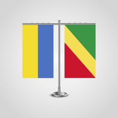 Table stand with flags of Ukraine and Republic of the Congo.Two flag. Flag pole. Symbolizing the cooperation between the two countries. Table flags