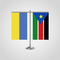 Table stand with flags of Ukraine and Southern Sudan.Two flag. Flag pole. Symbolizing the cooperation between the two countries. Table flags
