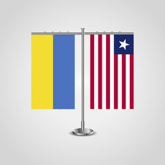 Table stand with flags of Ukraine and Liberia.Two flag. Flag pole. Symbolizing the cooperation between the two countries. Table flags