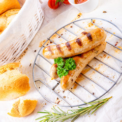 delicious bratwurst with ketchup and fresh rolls