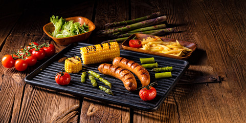 grilled krakauer with french fries and green salad