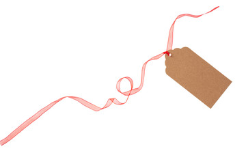 Beige isolated recycle tag with red satin ribbon top view on a white background