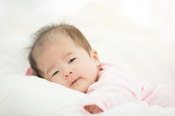 Beautiful smiling cute asian baby.