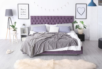 Bedroom interior with comfortable soft bed