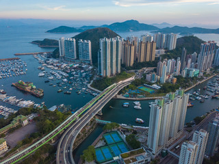 Panoramic Aerial view of the Aberdeen Harbour (Aberdeen Typhoon Shelter) and Ap Lei Chau Bridge in Hong Kong