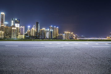 Panoramic skyline and buildings with empty road，chongqing city at night