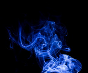 Fototapeta premium Blue smoke on black background