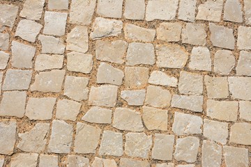 Square stone pavement cobbles, Albufeira, Portugal.