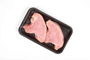 Raw dietary turkey meat pieces in tray, isolated on white background