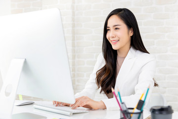 Asian businesswoman working on computer in the office
