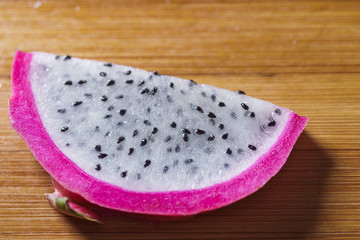 Dragon fruit in hand isolated