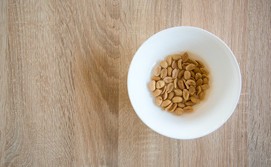 Peanut in white bowl