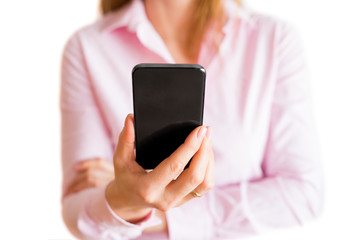Woman looking at her mobile phone. Isolated on white background.