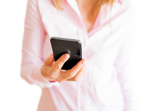 Woman holding mobile phone in hand. Isolated on white background.