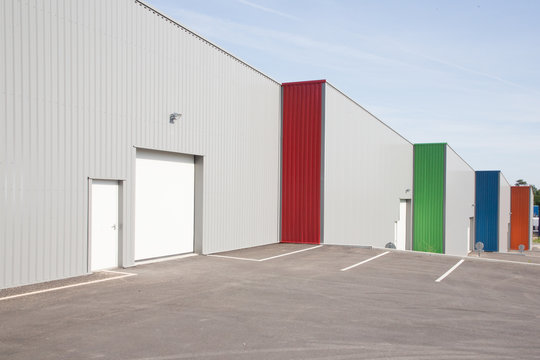 Grey silver Industrial Unit with roller shutter doors building