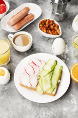Various healthy breakfast on gray background