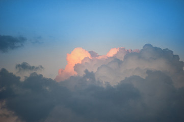 Huge fluffy clouds on the blue sky