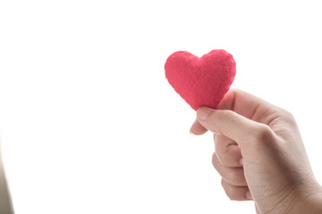 Obraz premium red heart in human hand with dramatic tone