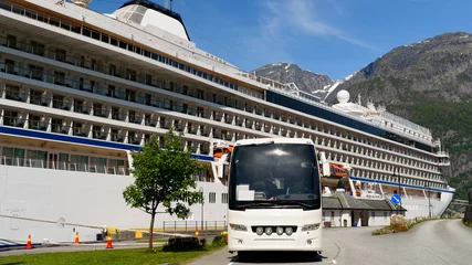 Poster Tourist bus parked in front of a cruise ship in Eidfjord, Norway, on a sunny day. Lovely mountain landscape behind the ship. Logos and id removed. © imfotograf