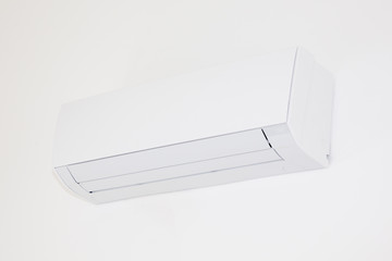 White color air conditioner machine isolated on wall background