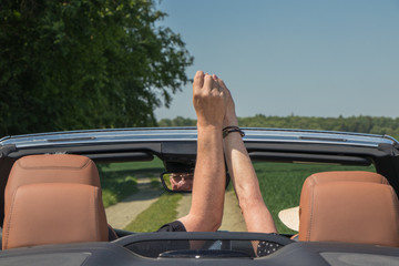 Senior couple in sports car