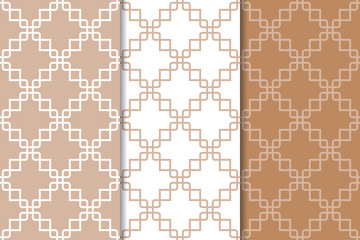 Brown and white geometric ornaments. Set of seamless patterns