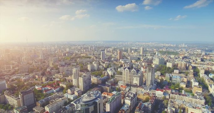 Aerial Drone Flight Footage: Picturesque cityscape of old central town in soft sunset light. Flight over the Boulevard of Taras Shevchenko, Kiev, Ukraine, Europe. Camera go down. 4K resolution.