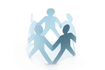 work group in an circle - concept with paper silhouette