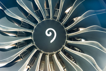 Airplane engine and blades close up sun light.