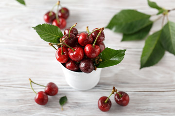 Fresh cherry with water drops on rustic wooden background. Fresh cherries background. Healthy food concept