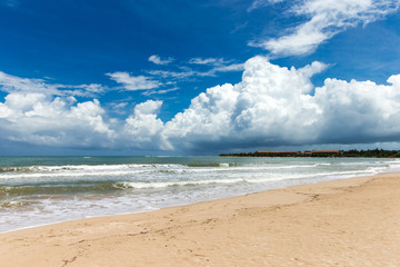 Fototapeta na wymiar Sea view from tropical beach with sunny sky. Summer paradise beach