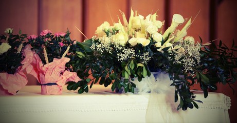 many pots of flowers on the altar with vintage effect