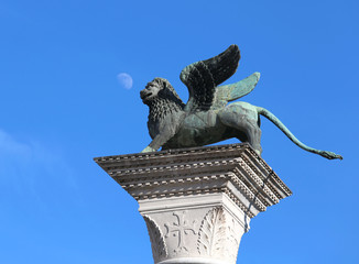 winged lion of the city of VENICE with the background of the blu