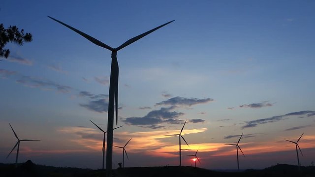 Beautiful wind turbines with sunset in Thailand