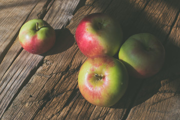 Apples on a wooden background.