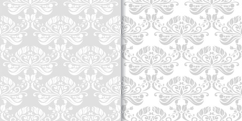 Light gray floral backgrounds. Set of seamless patterns