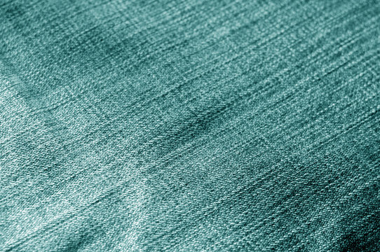 Cyan color jeans cloth pattern with blur effect.