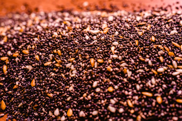 closeup Small seeds superfoods, chia, golden flax and sesame