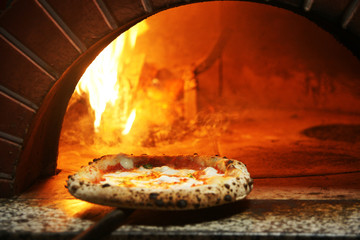 Neapolitan pizza in a wood stove - obrazy, fototapety, plakaty