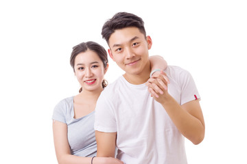 Happy young couple. Portrait of cheerful couple smiling looking at camera. 