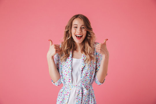 Portrait of an excited young woman in summer dress