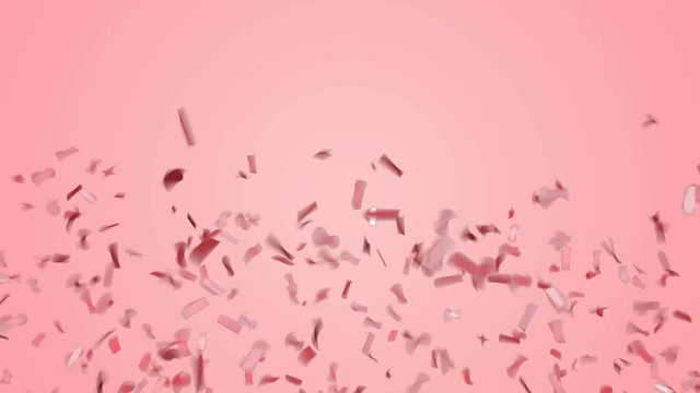 Abstract red or rose gold confetti falling on pastel pink background.