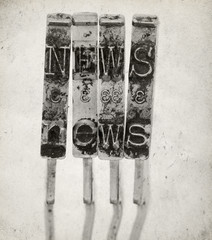 The word NEWS ith old typewriter hammers